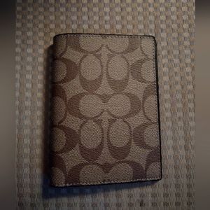 Iconic COACH brand passport case
